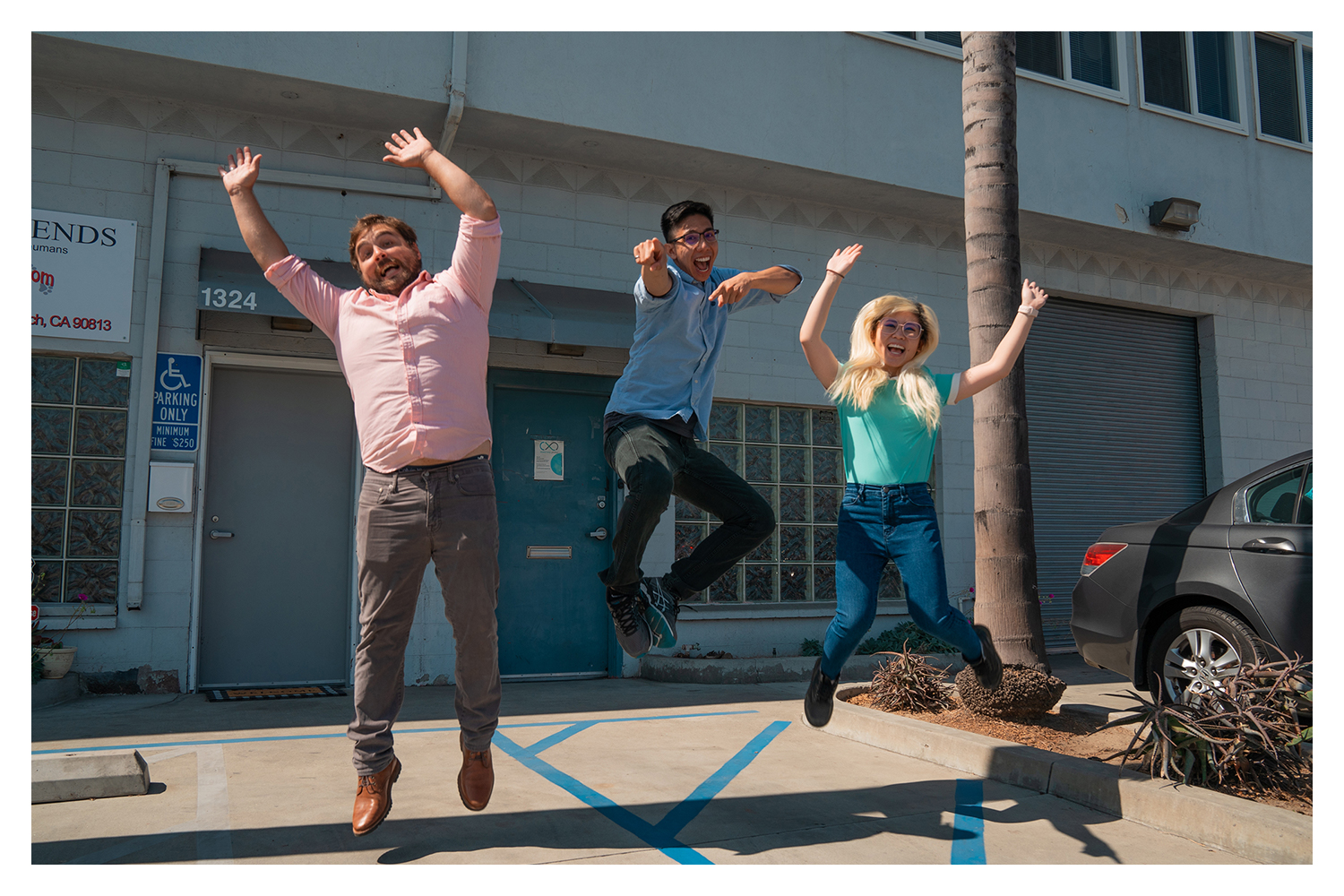 The Closed Loop Plastics team, (from left) Will Amos, Aldrin Lupisan and Sharon To jump for joy in front of their facility in Long Beach. 